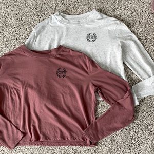2 PINK Victoria’s Secret long sleeve T-shirts.